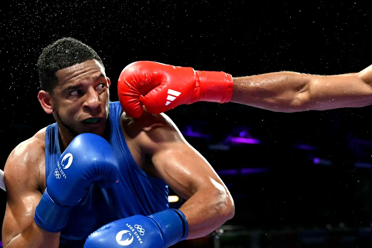 Spain's Enmanuel Reyes Pla is punched by Belgium's Victor Schelstraete in the men's 92kg quarter-final boxing match during the Paris 2024 Olympic Games at the North Paris Arena