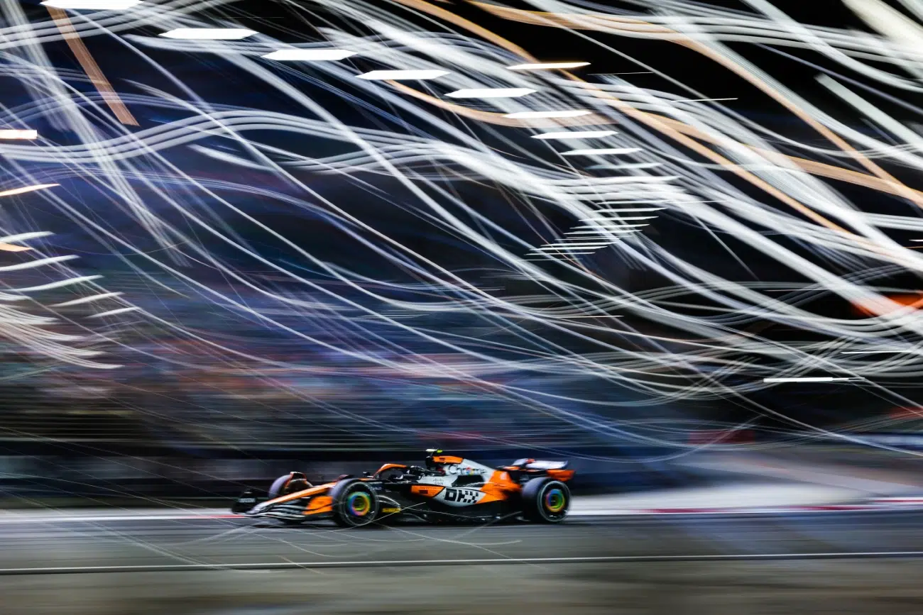 Formula 1 car racing with streaks of light in the background